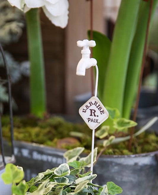 Vintage-Inspired Faucet Planter Decoration